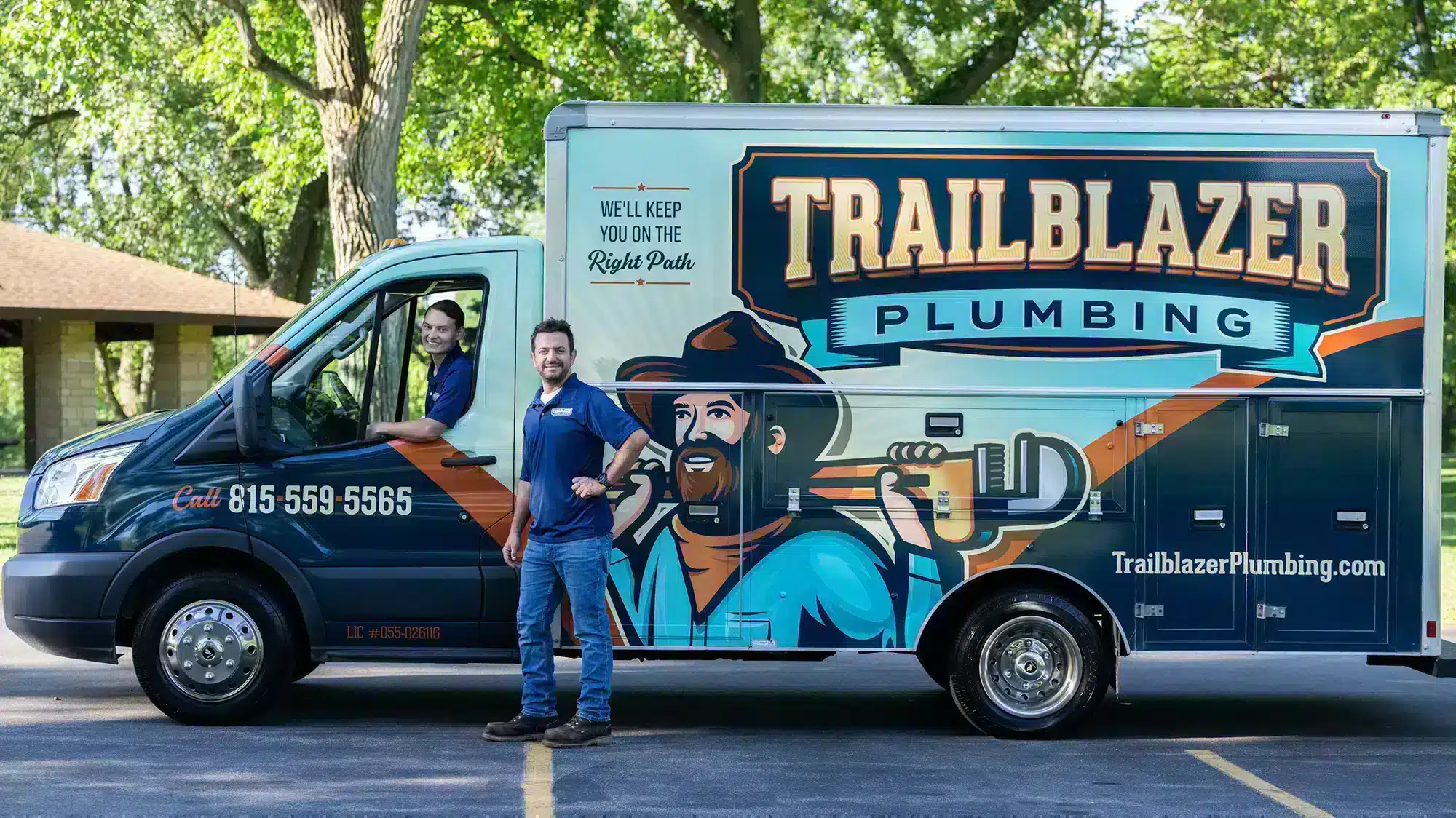 Trailblazer technicians in front of logo truck providing lockport outdoor plumbing services