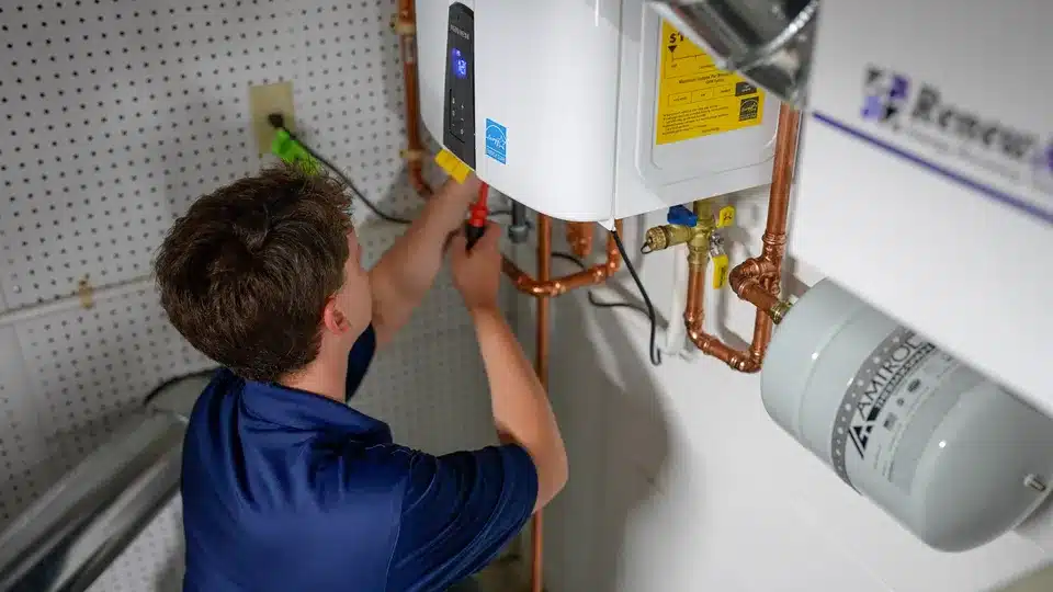 Trailblazer tech working on tankless water heater in Lockport.