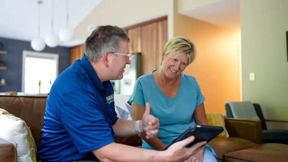 Trailblazer Plumbing tech helping customer with options in residential home in Lockport.