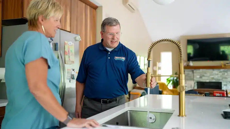 Trailblazer tech talking to customer in residential home in Lockport.