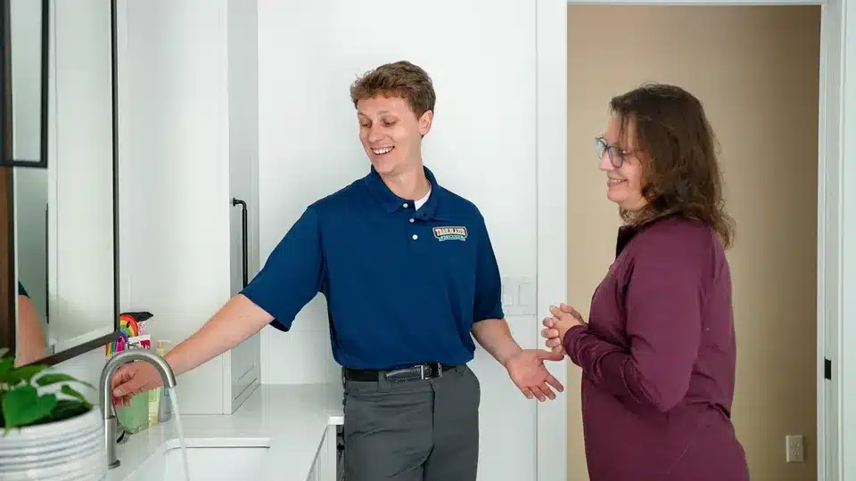 Trailblazer tech talking to customer in residential home in Lockport.