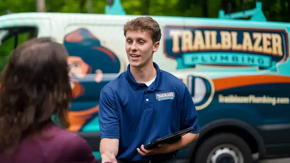 Trailblazer Plumbing tech shaking hands with customer in Lockport.
