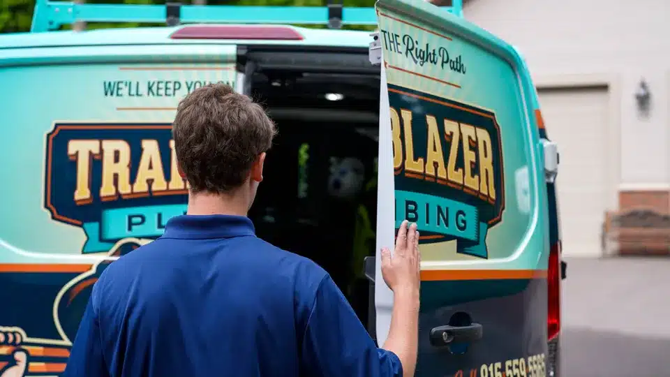 Trailblazer Plumbing technician walking towards van in Lockport.