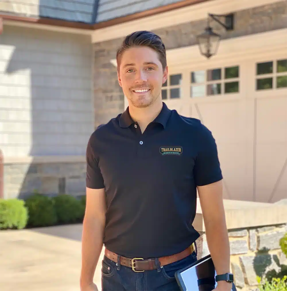 Trailblazer technician in front of residential home in Lockport, IL.